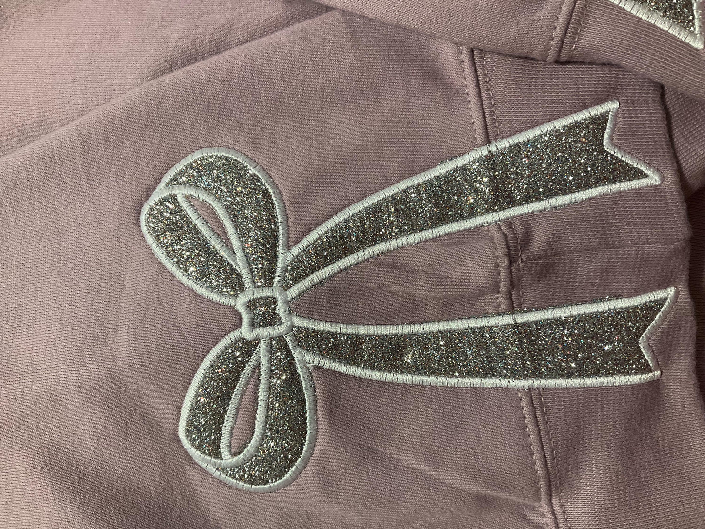 Embroidered Glitter Bow Sweatshirt: Side Appliqué Design