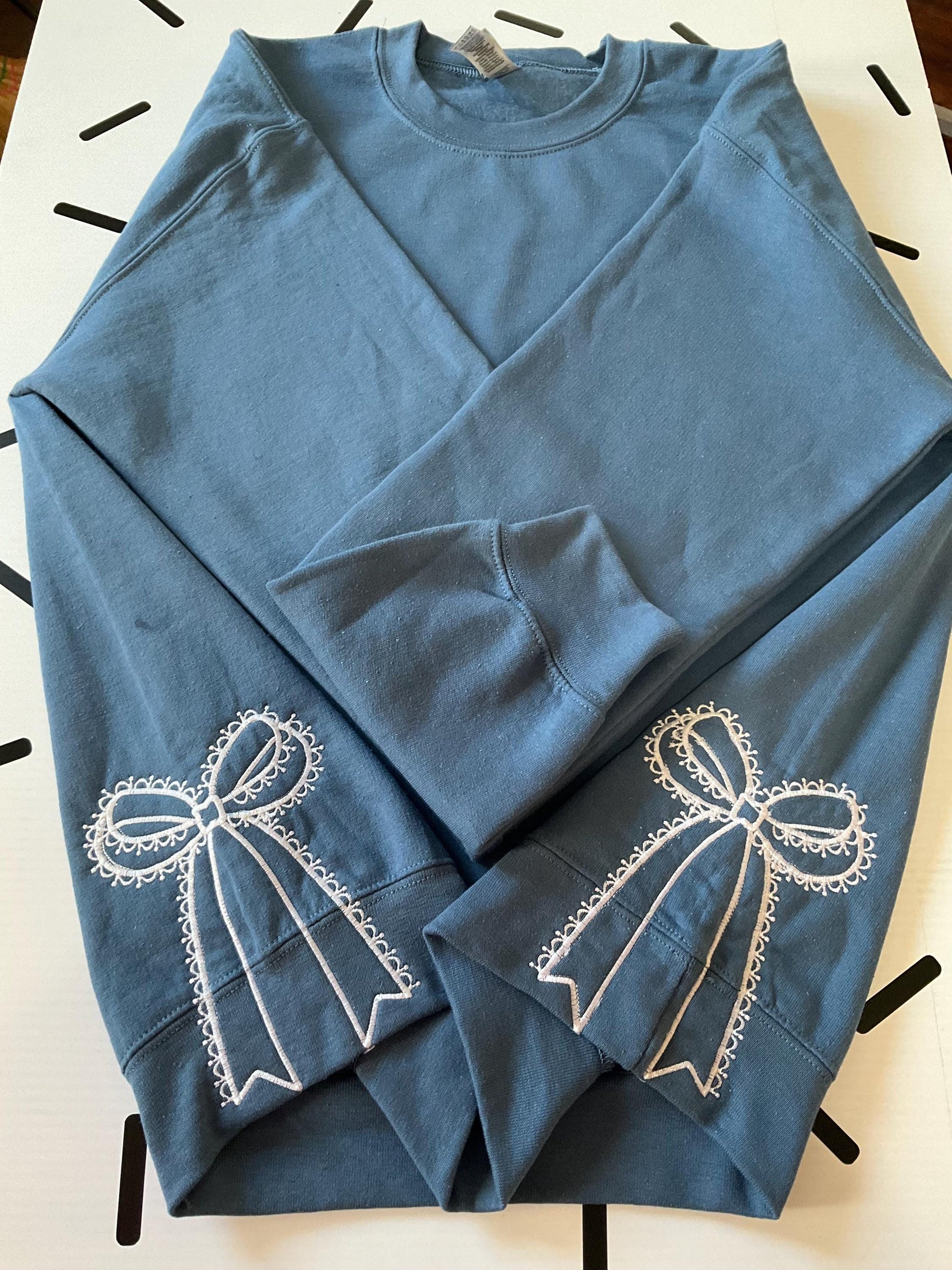 Embroidered Side Bow Sweatshirt: Classic Lace Design